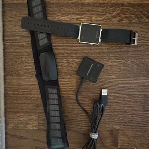Garmin vivoactive smartwatch, charger, and heart rate monitor